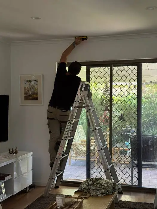 On-site measuring for custom S-Fold curtains in an Adelaide living room