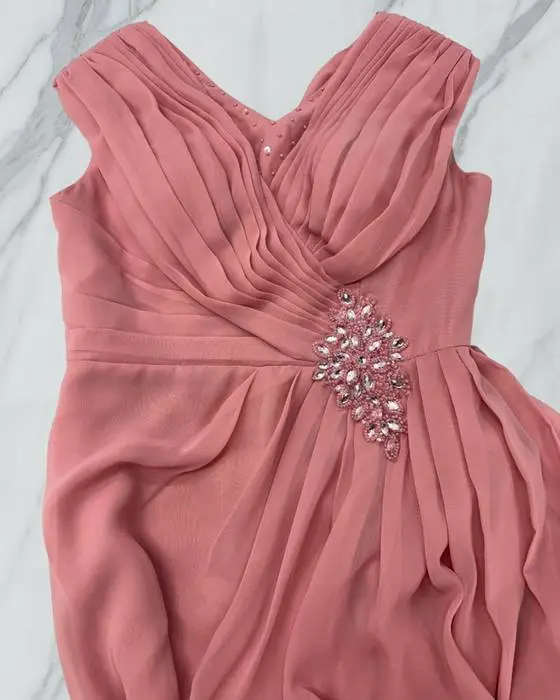 Close-up of pink bridal dress after bodice and neckline alterations