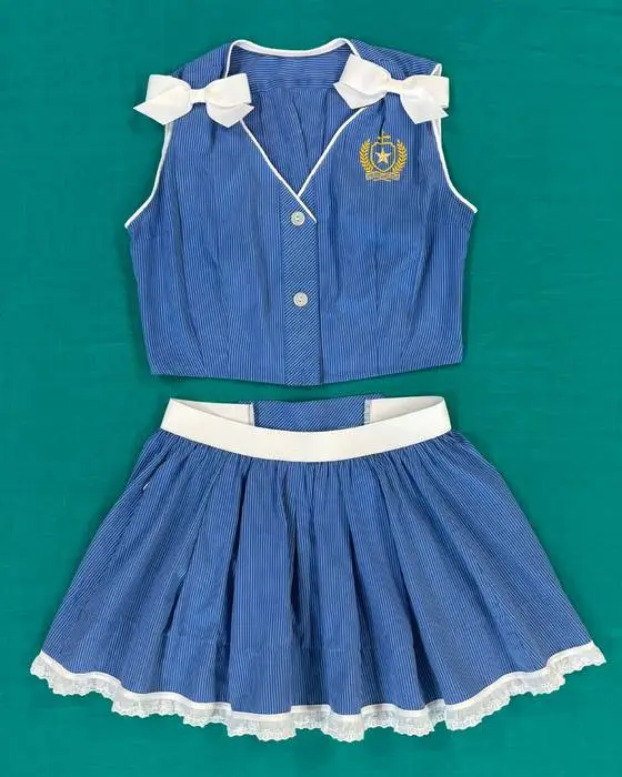 Schoolies uniform transformation with bow-detail top and pleated lace-trimmed skirt