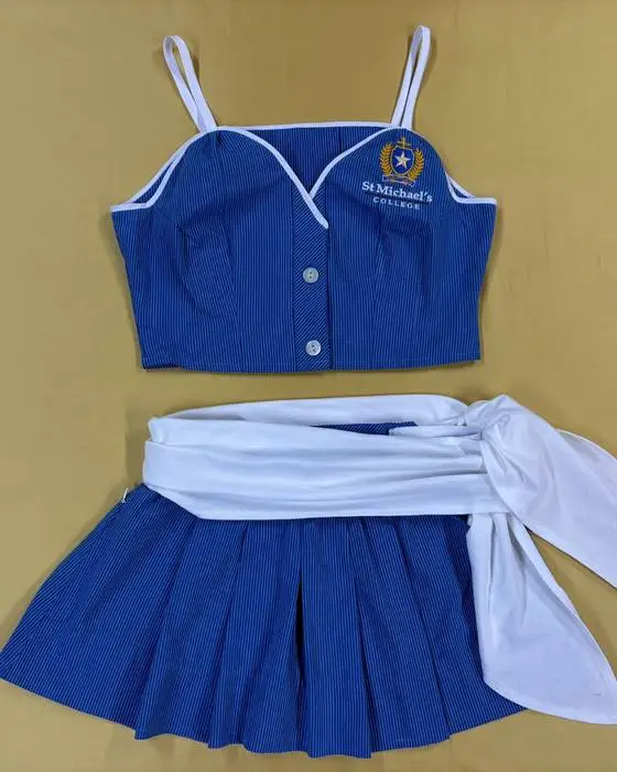 School uniform transformed into a blue two-piece Schoolies outfit with white sash