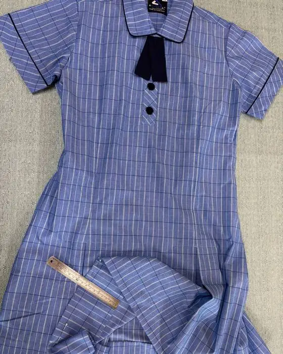 Original school uniform dress before transformation into a Schoolies outfit